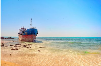 Scenic view of sea against clear blue sky