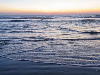 Scenic view of sea at sunset