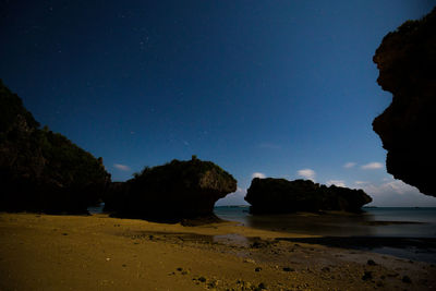 Scenic view of sea against sky at night