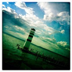 Scenic view of sea against cloudy sky