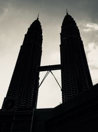 Low angle view of building against cloudy sky