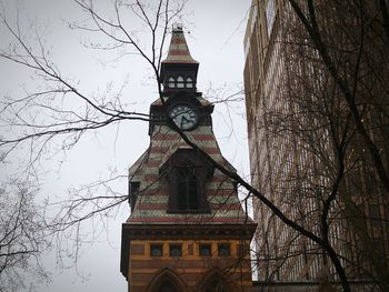 Low angle view of clock tower against sky