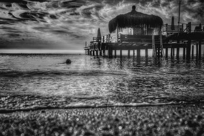 View of calm sea against cloudy sky