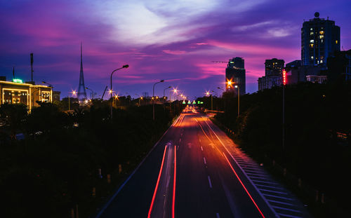 High angle view of light trails on road at night