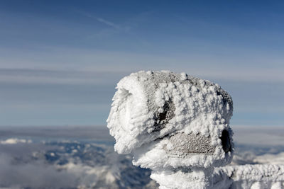 Close-up of snow against sky