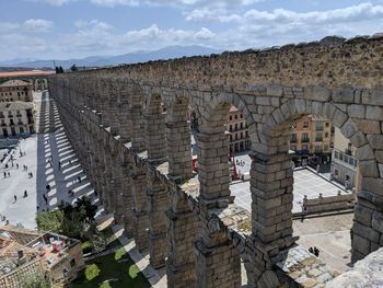 High angle view of old building against cloudy sky