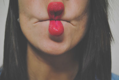 Close-up of woman with red face