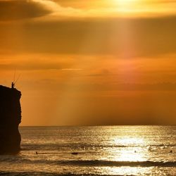 Scenic view of sea at sunset