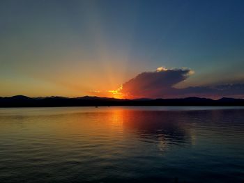 Scenic view of lake at sunset