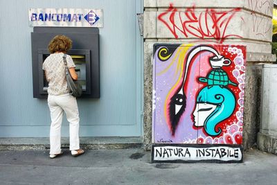 Woman standing in front of door