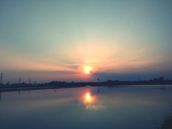 Scenic view of sunset over river