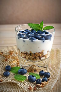 Close-up of blueberries in yogurt on table