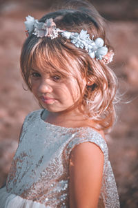 Portrait of girl standing outdoors