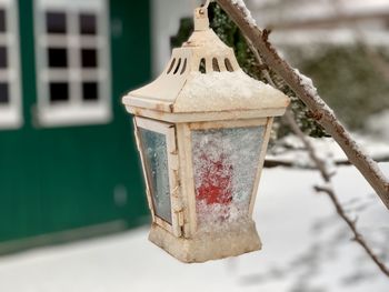 Close-up of birdhouse hanging on tree