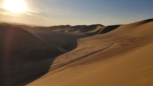 Scenic view of huacachina desert against sky