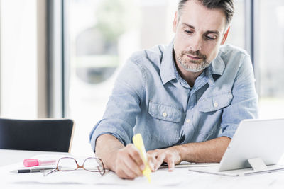 Businessman working at desk in office
