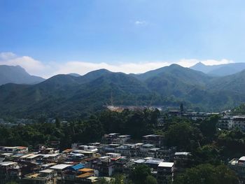 High angle view of townscape and mountains against sky