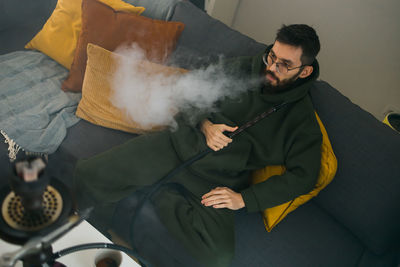 Portrait of young man working at home