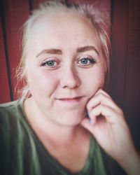 Close-up portrait of smiling woman at home