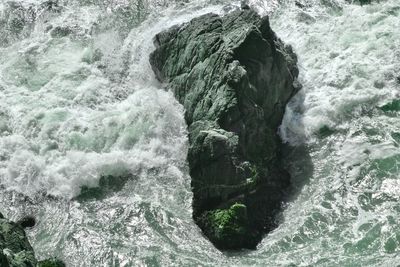 High angle view of rocks in sea