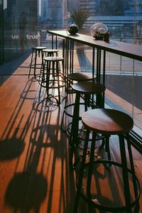 Empty stools by table in cafe