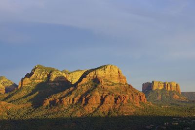Rock formations on mountain against sky