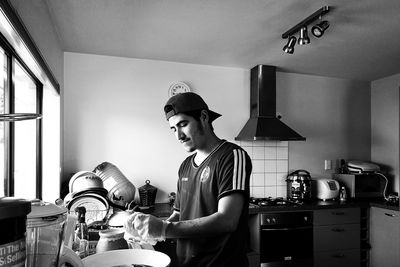 Man working in kitchen at home