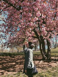 Full length of man on tree against sky