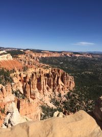 Scenic view of landscape against blue sky
