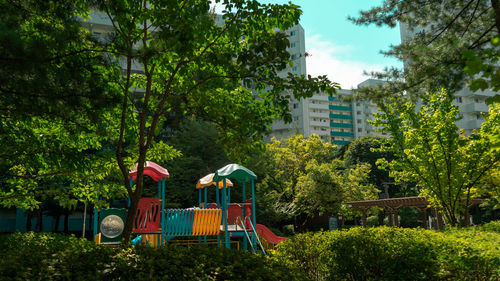 Built structure by trees in park