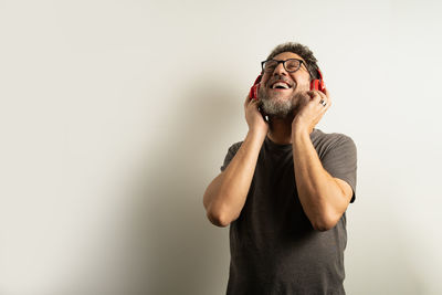 Man looking away against white background