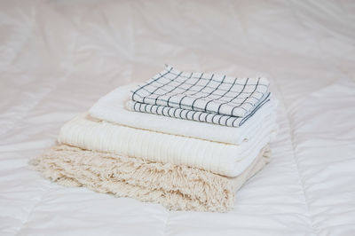 High angle view of beauty products on bed