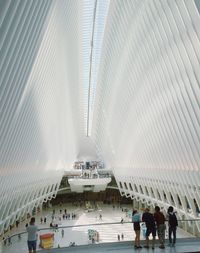 Group of people walking in modern office building