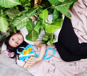 High angle portrait of girl lying on woman