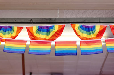 Low angle view of multi colored flags