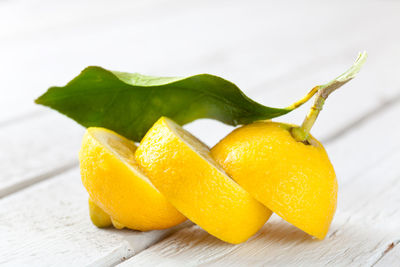 Close-up of fruits on table against white background