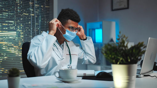 Female dentist working at desk