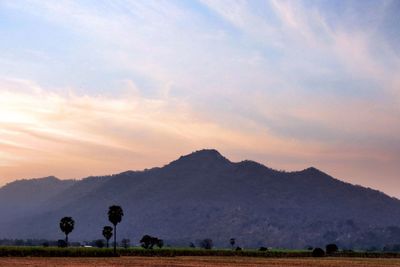 Scenic view of field against sky during sunset