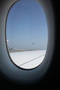Scenic view of sea seen through airplane window