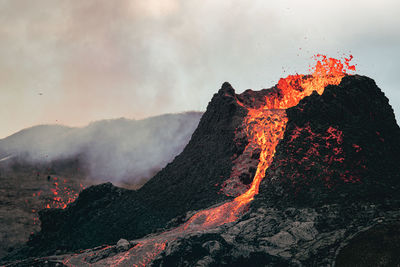 Scenic view of volcanic mountain against sky