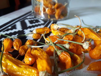 Close-up of dried red chili peppers on table