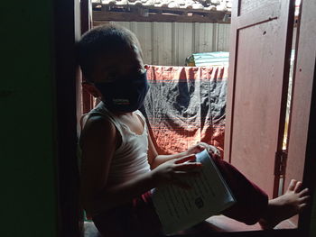 Portrait of girl holding book