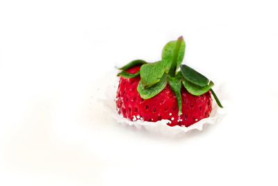 Close-up of strawberry cake against white background