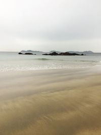 Scenic view of beach against sky