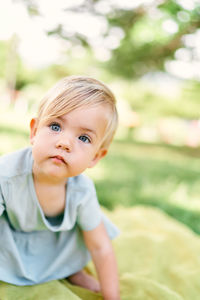 Cute girl looking away at park