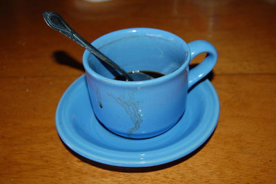 High angle view of coffee cup on table