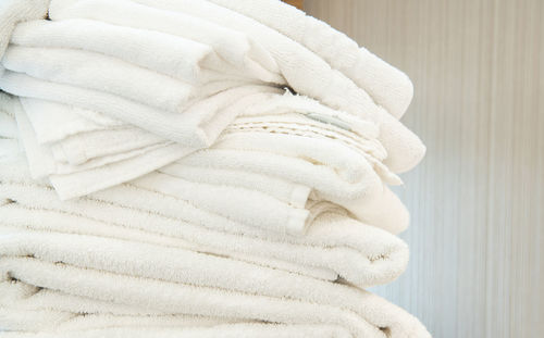 Close-up of towels on bed