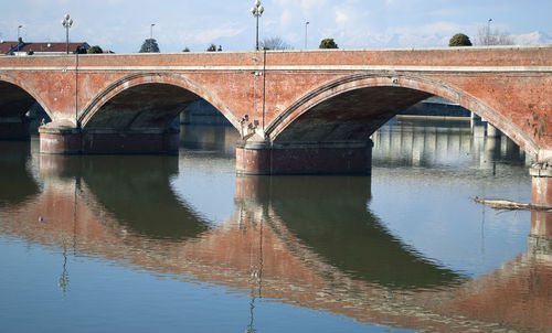 Arch bridge over river