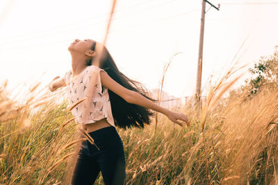 People walking on grassy field