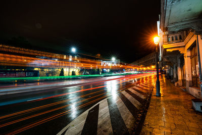 High angle view of light trails on road at night